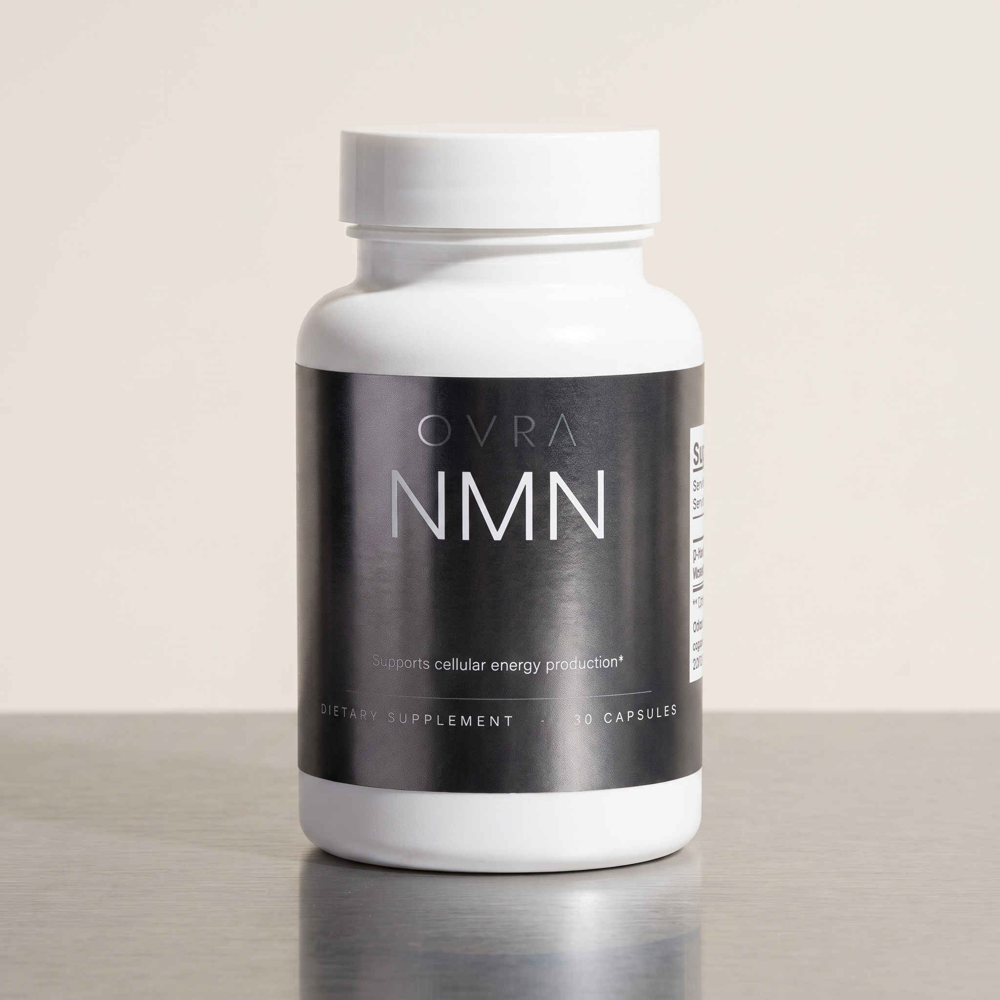 OVRA NMN bottle on brushed steel