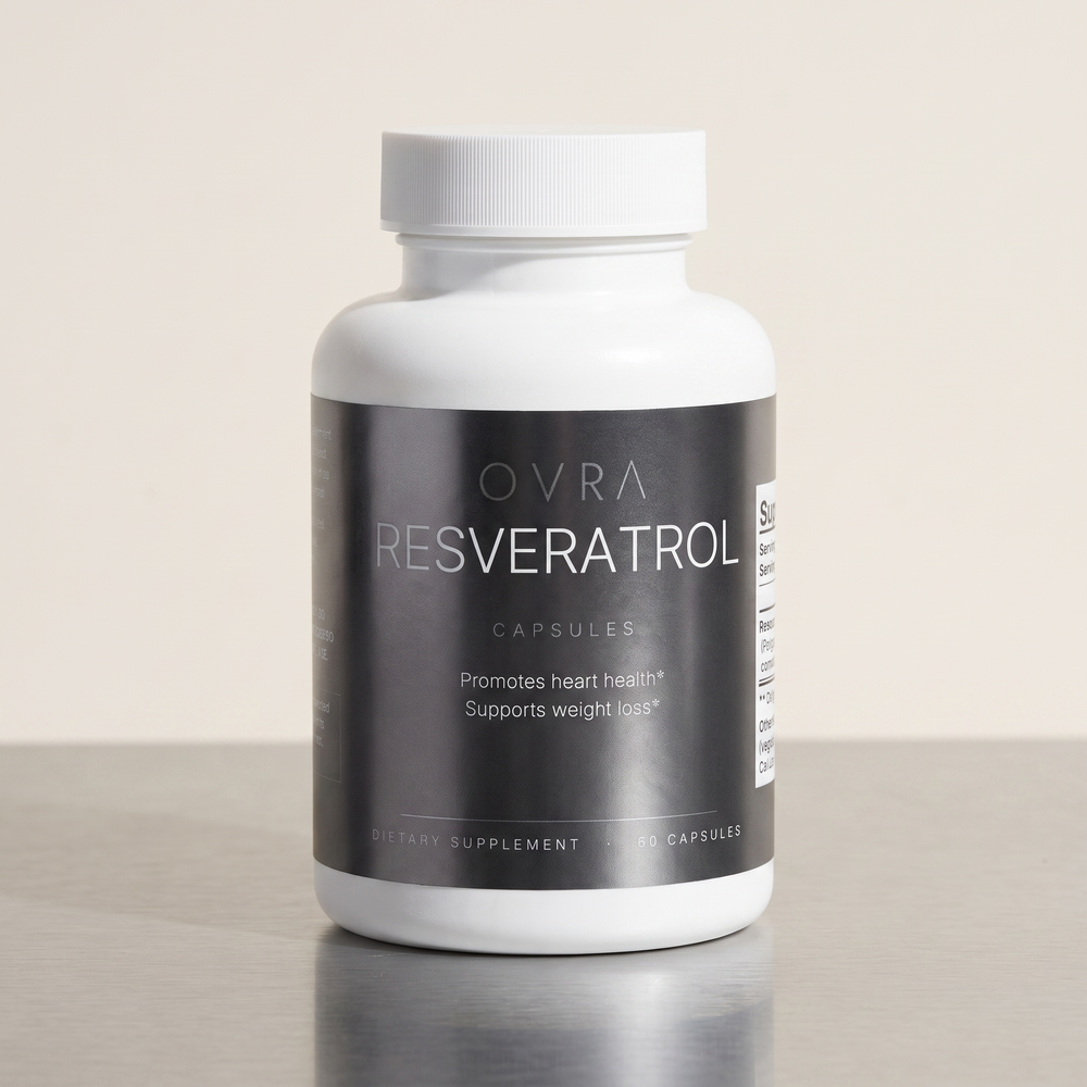 OVRA Resveratrol bottle on brushed steel, bone-white studio background