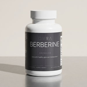 OVRA Berberine bottle on brushed steel, bone-white studio background