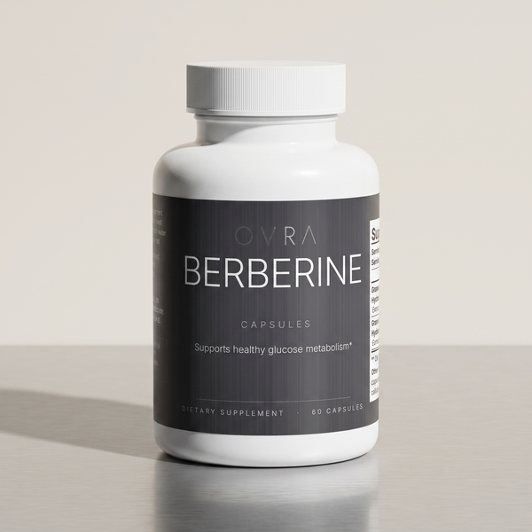 OVRA Berberine bottle on brushed steel, bone-white studio background