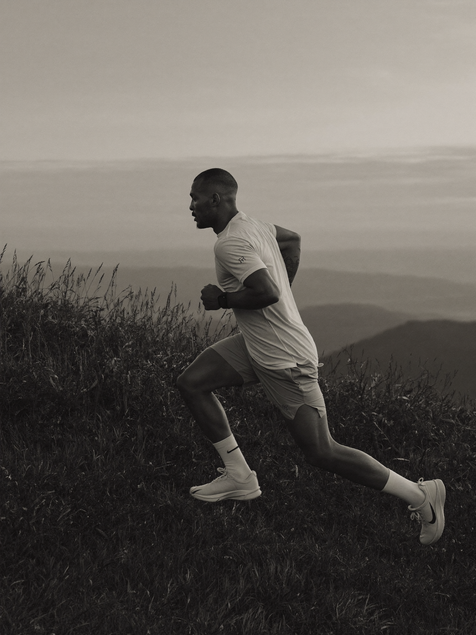 Trail runner at dawn, monochrome